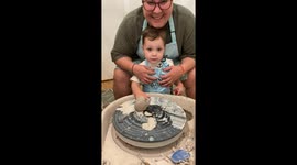 Joyous toddler's masterful work on pottery wheel makes him clap for himself!
