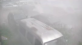 High-rise wall peeling damages cars in northern China