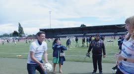Andy Burnham and Angela Rayner practice headers and kick-ups at women's football event in Manchester