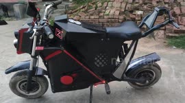 A young boy wonders by making an e-bike out of junk thats operate by remote control in Northern India