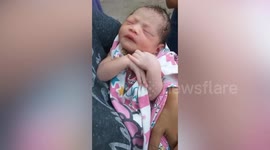 Abandoned newborn girl with umbilical cord still attached found near rubbish bin