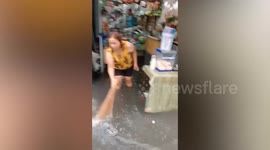 Food stall drifts away in monsoon flood in the Philippines
