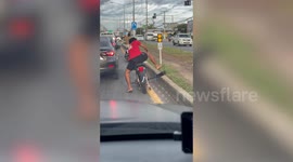 Motorcycle rider has giant exhaust pipe annoying fellow road users
