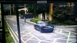 Tesla crashes through residential fire door, hitting cleaning worker in China