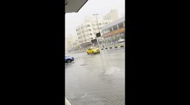 Garbage Drum Floats Down Street In Heavy Rain