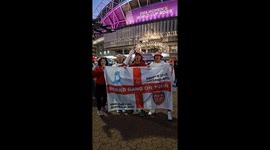 England fans cheer outside the stadium ahead of the final