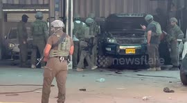 Israeli forces inspect the site near the Hawara checkpoint, south of the West Bank city of Nablus