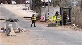 Israeli security forces block a road in Baita village during the search for the suspected perpetrator of an attack a day earlier which killed two Israelis in Huwara village in the West Bank.