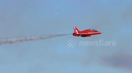 Red Arrows crossovers in slow motion at the Eastbourne Airbourne air show, UK