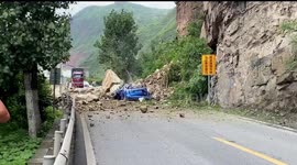 Six miraculously rescued after car crushed by rocks in southern China