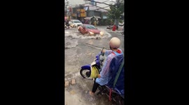 Streets flooded like rivers during heavy rains in Vietnam