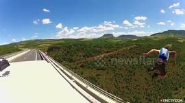 This Man BASE Jumps Off A Bridge From A MOVING Van