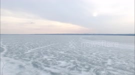 Drone footage above frozen lake in Canada