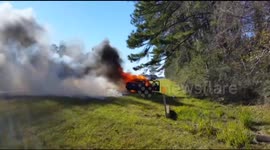 Man reacts stoically to car being on fire