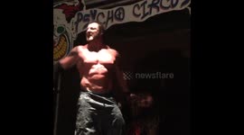 Wrestler drives opponent thru entrance walk way!!!