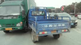 Motor tricycle hit by car at crossroads in China