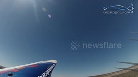 Airplane wing near to hit the ground