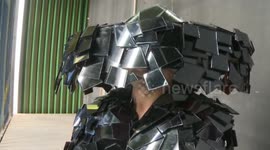 Man uses mirrors and glass to make clothes