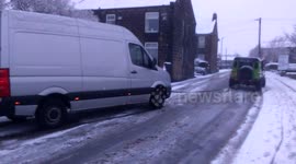 Van being towed after getting caught in Storm Jake snow