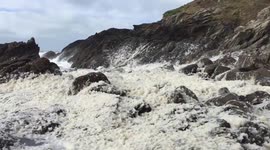 Large sea foam build-up in Cornwall during Storm Jake