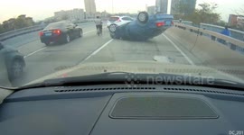 Car tries to change lanes with no room and ends up flipping over