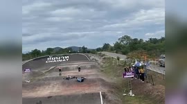 Mountain bike racer flips head-over-handlebars causing pile-up crash on course