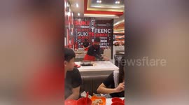 Fast-handed waiter clears away dishes with incredible speed