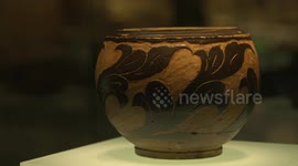 Fixed close-up of Xixia Black Brown Glaze Carved Flower Pattern Cans in Xixia Museum, Yinchuan City, Ningxia.