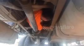 Missing inmate reenacts 'action film' escape from jail by clinging onto truck's undercarriage