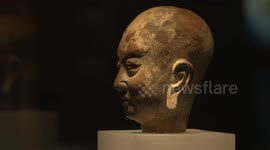 Fixed shot close-up of Arhat head in Xixia painted clay sculpture in Xixia Museum, Yinchuan, Ningxia.