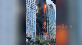 Huge fire rips through high-rise building in northeastern China
