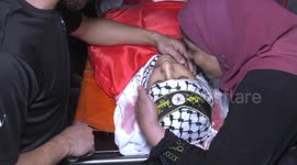 Palestinians carry the body of Othman Abu Khurog, 17, during his funeral procession at Zababdeh village near Jenin in the West Bank.