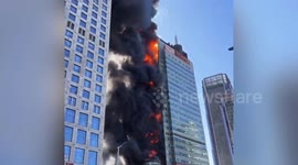 A high-rise building caught fire in the central urban area of Tianjin.