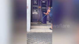 Large water monitor lizard caught outside ATM centre