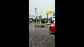 Water Tank Floats Down Flooded Street in Mexico