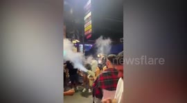 American tourist apologises over Ghostbusters style gun blowing cannabis over people