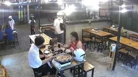 Diners terrified when brazen muggers raid restaurant and steal their bags in the Philippines