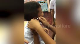 Teacher helps remove padlock stuck in pupil's ear