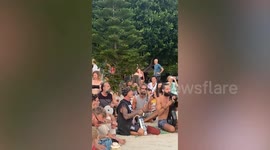 Backpackers have bizarre musical party on Thai island beach