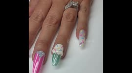 Woman leaves TikTok users in shock after adding complete TEA SET to her nails Part 2/3