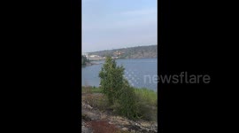 Planes Collect Water to Extinguish Wildfires in Yellowknife, Canada