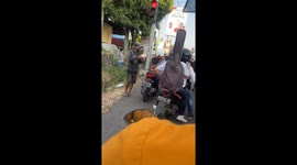 Unpredictable reactions: monkey's grumpy response to generosity caught on video in Surakarta traffic