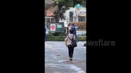 Tense moment police stand-off with knife-wielding man in Tokyo
