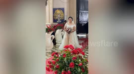 Delighted bride, 69, wells up walking down the aisle to marry toyboy groom, 30, in church ceremony