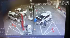 Worker dodges fire that erupts from car engine while refuelling in China
