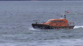 Amazing moment dolphins swim alongside RNLI lifeboat in Whitby