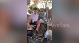 Inspiring teen without arms cooks egg omelette and draws pictures