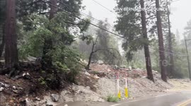 Mudflow surges onto road in aftermath of Tropical Storm Hillary in California