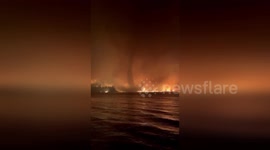 Rare 'fire tornado' forms over British Columbia, Canada during raging wildfires