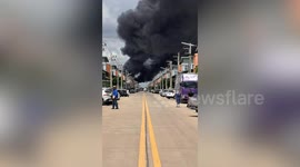 Firefighters battle blaze tearing through glue factory in Thailand